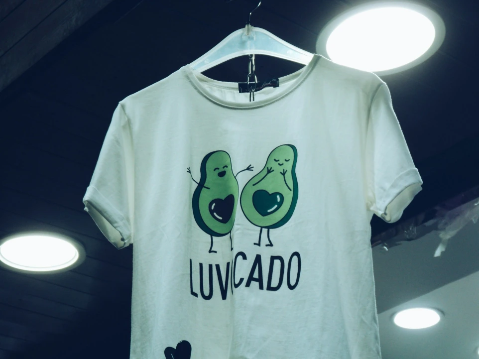 printed white t-shirt with avocado graphic and text by BaluBarry